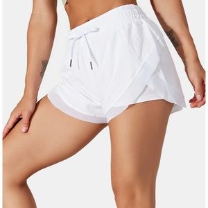 White womens athletic shorts from Halara.
